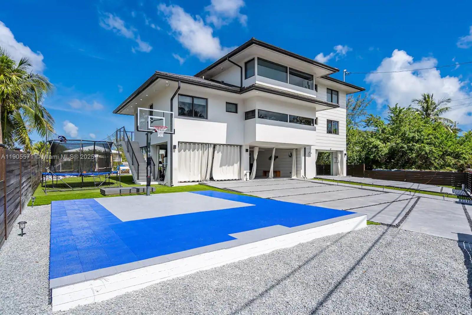 32 North Bounty Lane, Unit 32 Key Largo, FL 33037 - Photo 11 of 55 a front view of house with yard and swimming pool