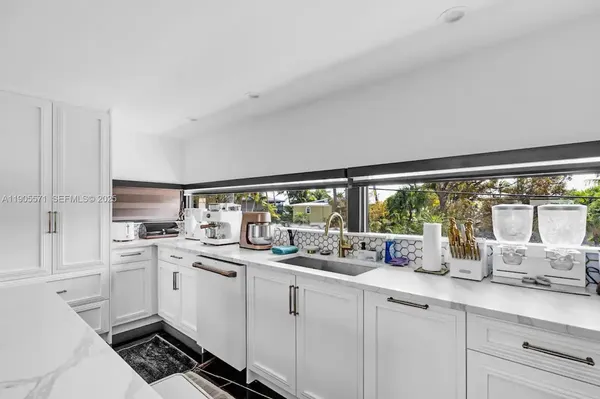 a bathroom with a tub and shower