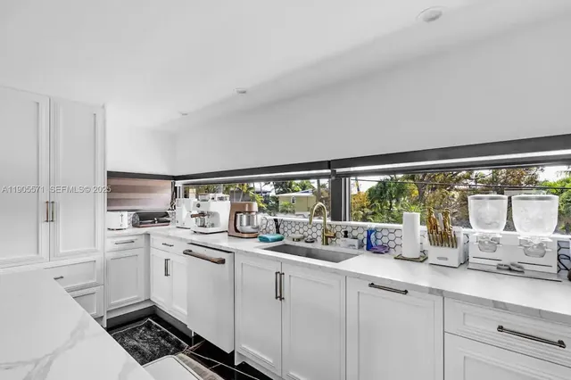 a bathroom with a tub and shower
