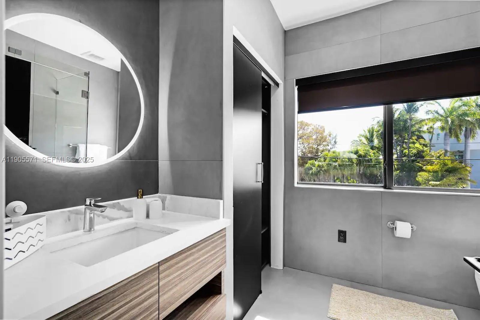 32 North Bounty Lane, Unit 32 Key Largo, FL 33037 - Photo 18 of 55 a bathroom with a double vanity sink and a mirror