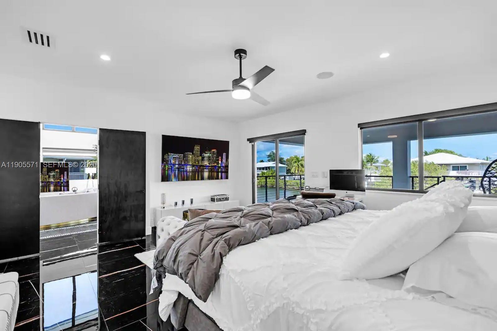 32 North Bounty Lane, Unit 32 Key Largo, FL 33037 - Photo 23 of 55 a bed room with bed and tv