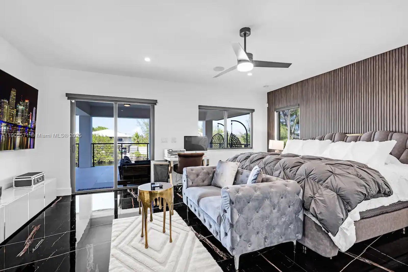 32 North Bounty Lane, Unit 32 Key Largo, FL 33037 - Photo 24 of 55 a bedroom with a bed and a chandelier