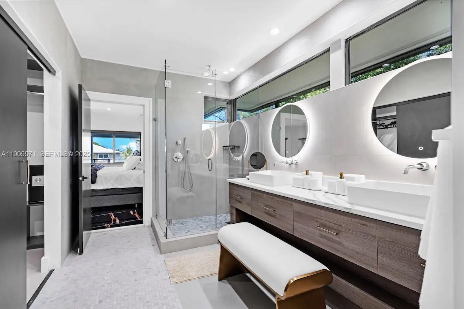 32 North Bounty Lane, Unit 32 Key Largo, FL 33037 - Photo 26 of 55 a en suite bathroom with a double vanity sink and a mirror