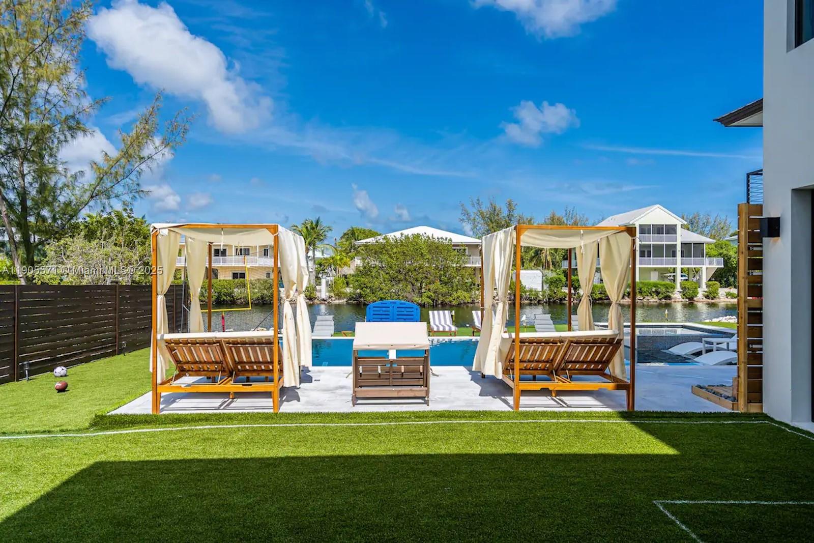 32 North Bounty Lane, Unit 32 Key Largo, FL 33037 - Photo 3 of 55 a garden view with a seating space