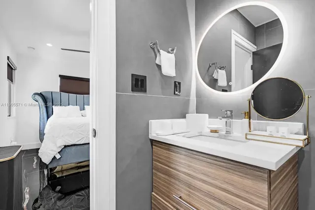 a bathroom with a sink and mirror