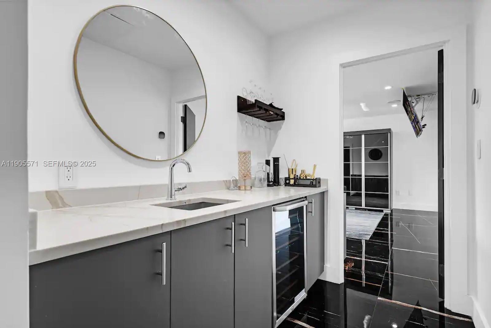 32 North Bounty Lane, Unit 32 Key Largo, FL 33037 - Photo 33 of 55 a bathroom with a double vanity sink and a mirror