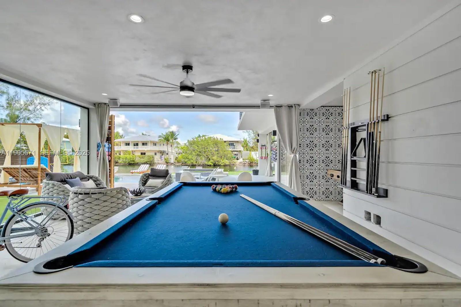 32 North Bounty Lane, Unit 32 Key Largo, FL 33037 - Photo 41 of 55 a room with gym equipment pool table and window