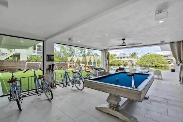 a dining room with furniture a window and a table