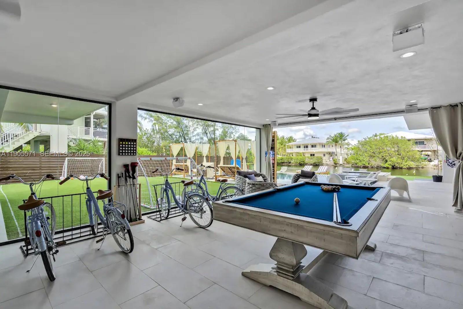 32 North Bounty Lane, Unit 32 Key Largo, FL 33037 - Photo 42 of 55 a living room with furniture and a large window