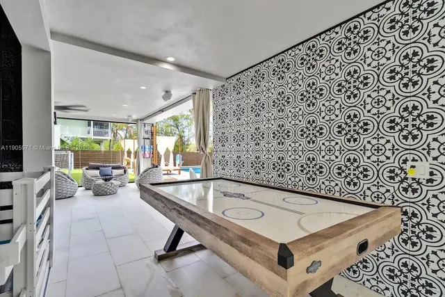 an aerial view of multiple houses with a yard