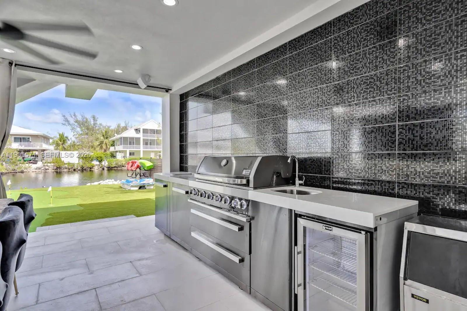 32 North Bounty Lane, Unit 32 Key Largo, FL 33037 - Photo 46 of 55 a kitchen with a stove and a sink
