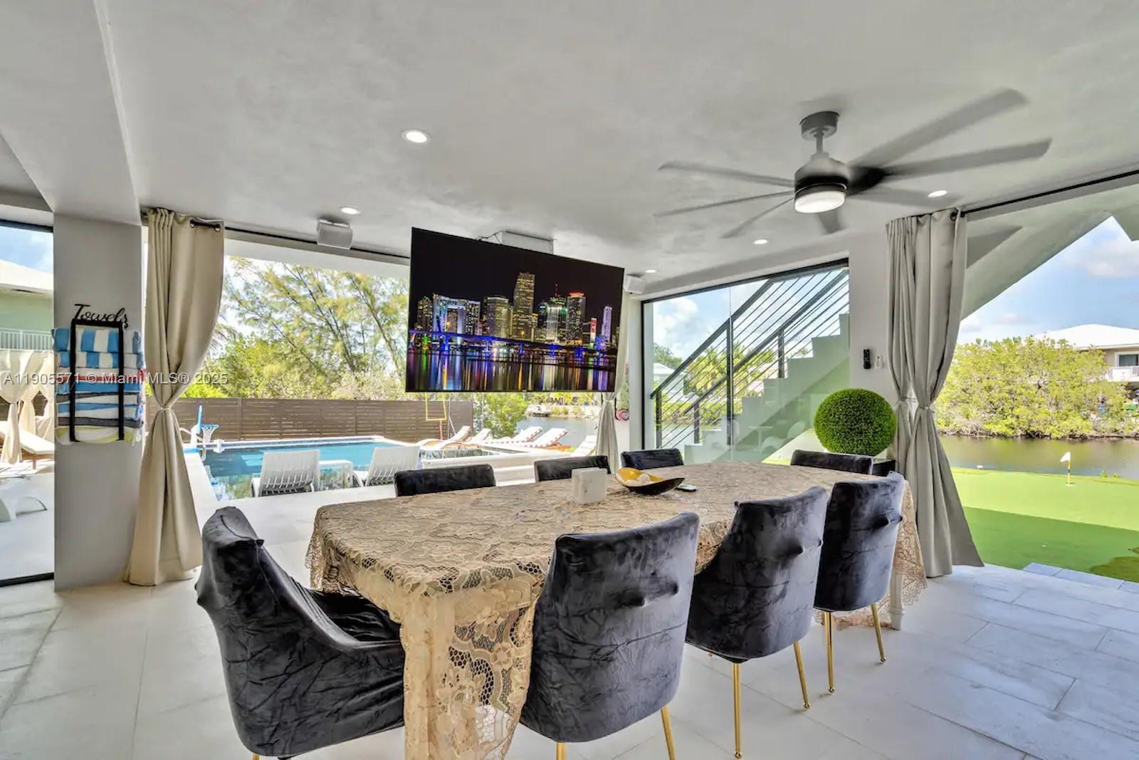 32 North Bounty Lane, Unit 32 Key Largo, FL 33037 - Photo 47 of 55 a dining room with furniture a window and a table