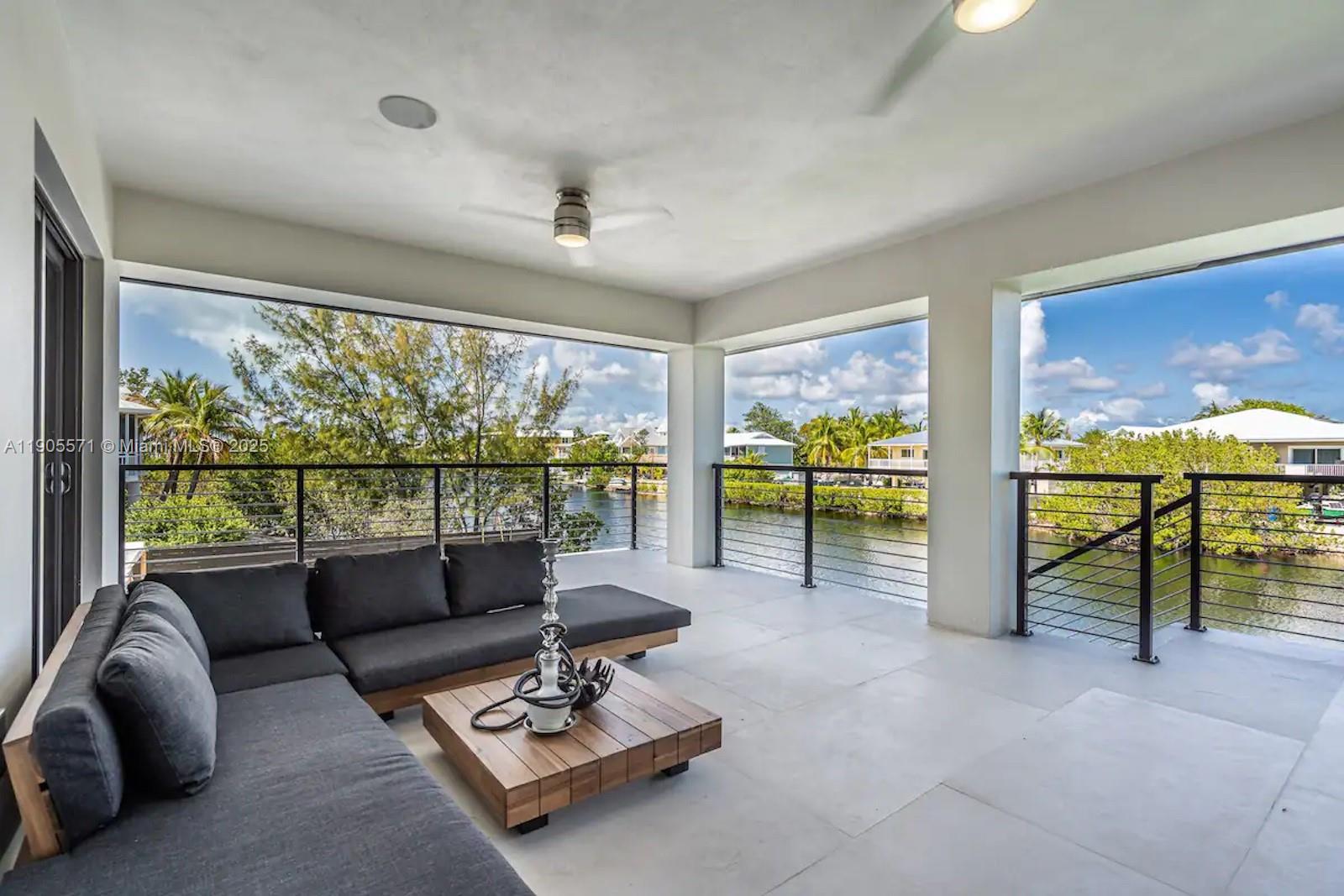 32 North Bounty Lane, Unit 32 Key Largo, FL 33037 - Photo 48 of 55 a living room with furniture and a large window