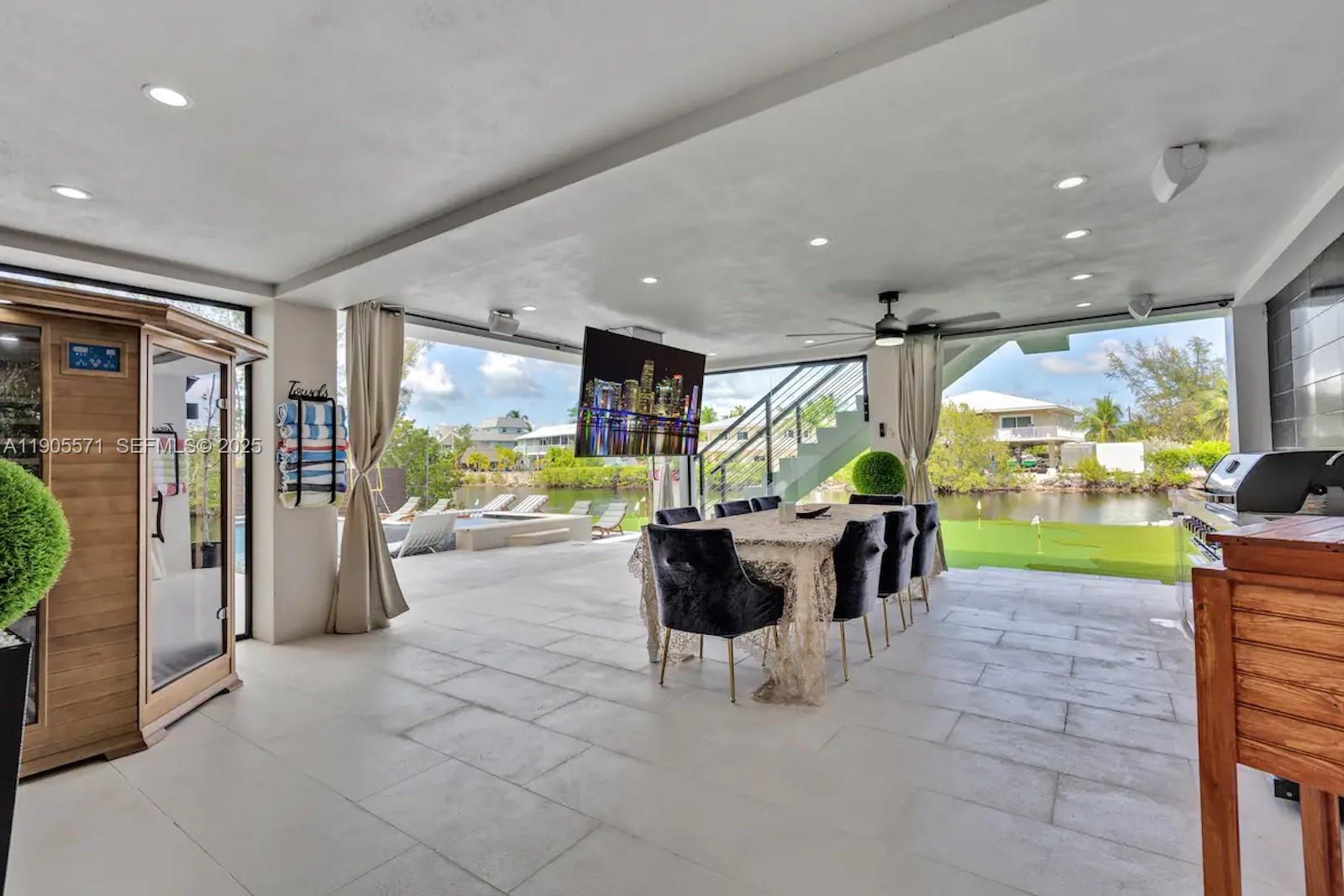 32 North Bounty Lane, Unit 32 Key Largo, FL 33037 - Photo 54 of 55 a view of a dining area with furniture window and outside view