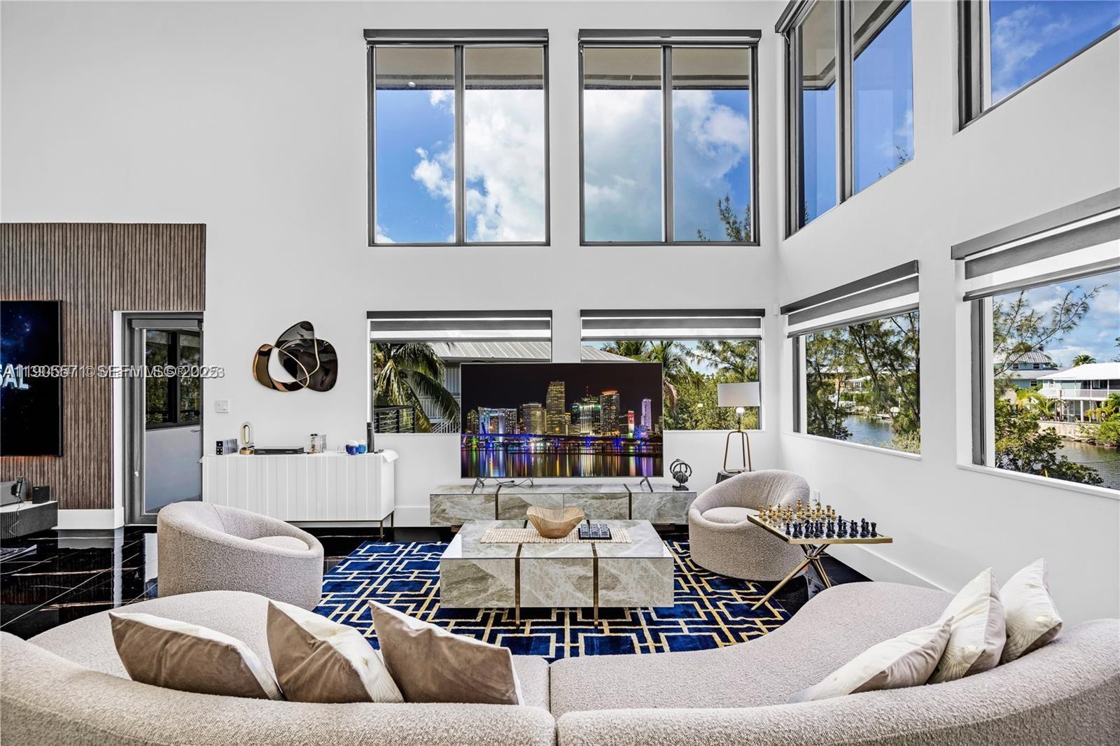 32 North Bounty Lane, Unit 32 Key Largo, FL 33037 - Photo 6 of 55 a living room with furniture and floor to ceiling windows
