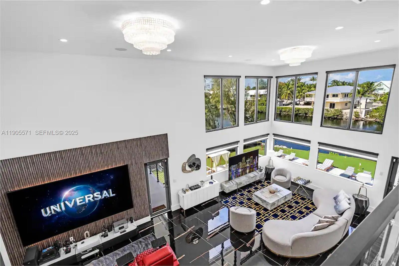 32 North Bounty Lane, Unit 32 Key Largo, FL 33037 - Photo 8 of 55 a living room with furniture and a fireplace