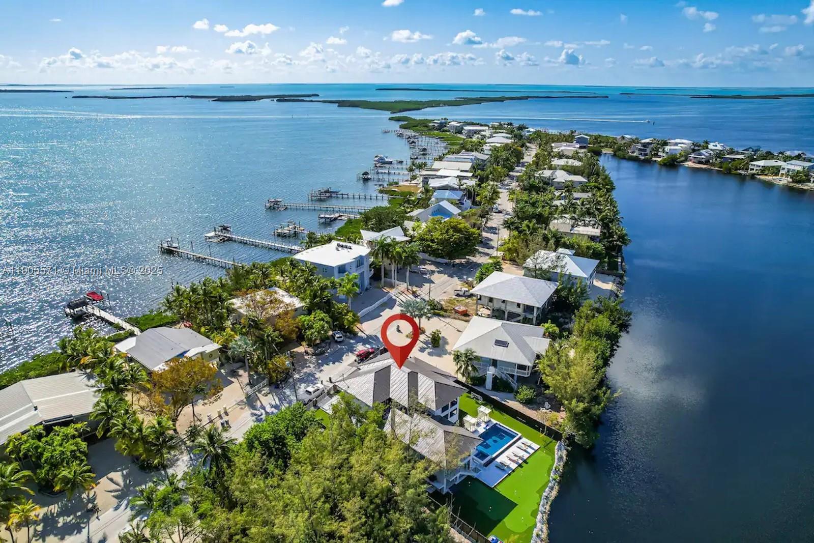32 North Bounty Lane, Unit 32 Key Largo, FL 33037 - Photo 10 of 55 an aerial view of a house with a yard and lake view