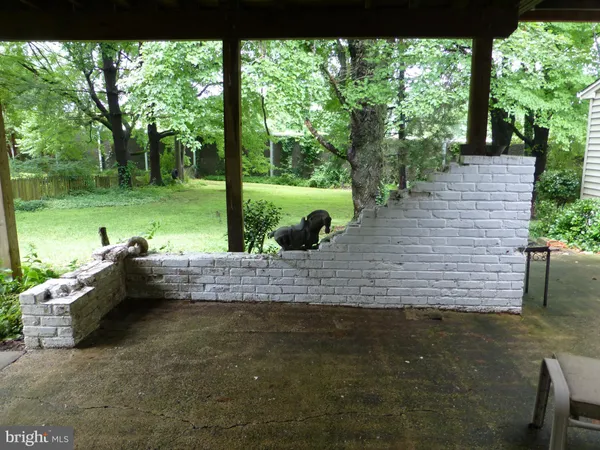 a kitchen with granite countertop a sink cabinets and stainless steel appliances