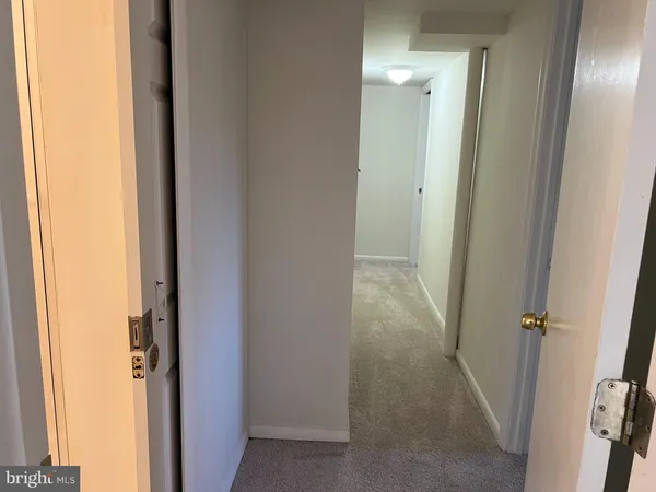 a kitchen with a sink and a refrigerator