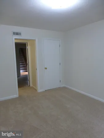a bathroom with a sink a toilet a mirror and shower curtain