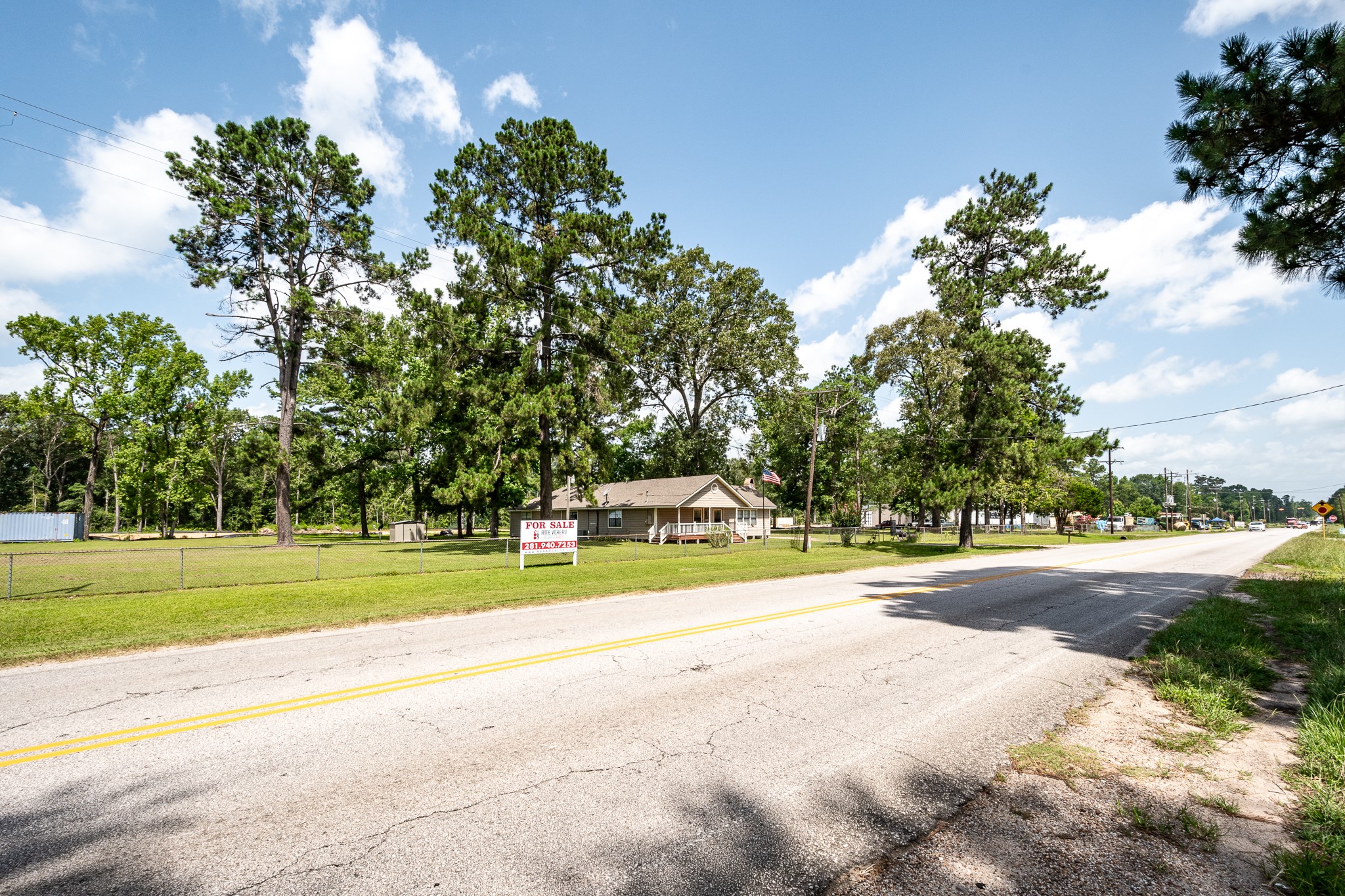 10994 Fostoria Road Cleveland, TX 77328 - Photo 11 of 13 a view of a swimming pool and a yard