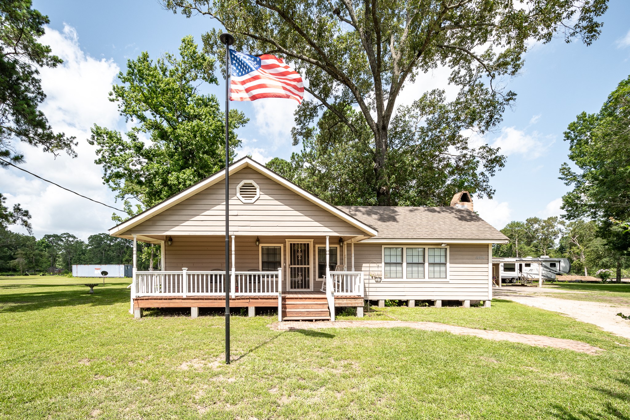 10994 Fostoria Road Cleveland, TX 77328 - Photo 4 of 13 a view of a house with a swimming pool