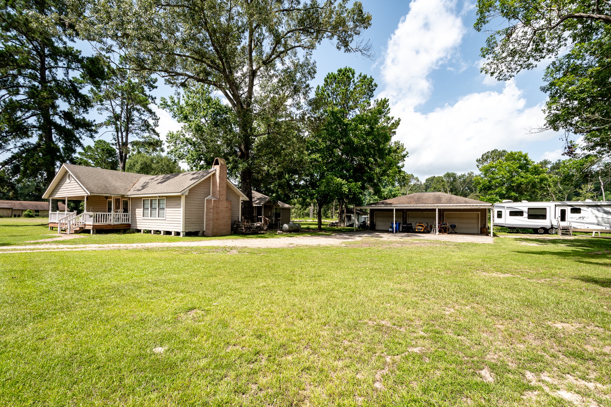 10994 Fostoria Road Cleveland, TX 77328 - Photo 8 of 13 a front view of a house with a garden