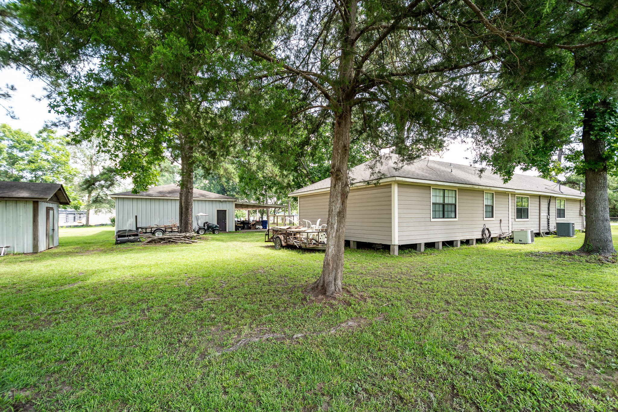 10994 Fostoria Road Cleveland, TX 77328 - Photo 9 of 13 a view of a house with a backyard