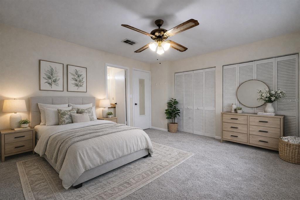 2635 Southwest 35th Place, Unit 604 Gainesville, FL 32608 - Photo 15 of 28 a bedroom with a bed and ceiling fan