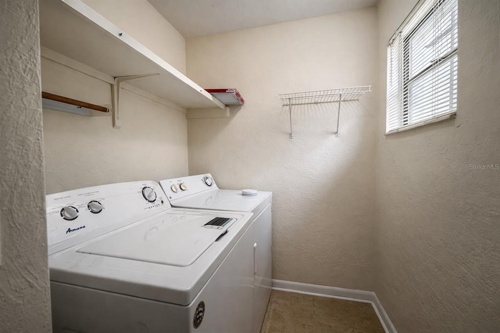 2635 Southwest 35th Place, Unit 604 Gainesville, FL 32608 - Photo 22 of 28 a utility room with dryer and washer