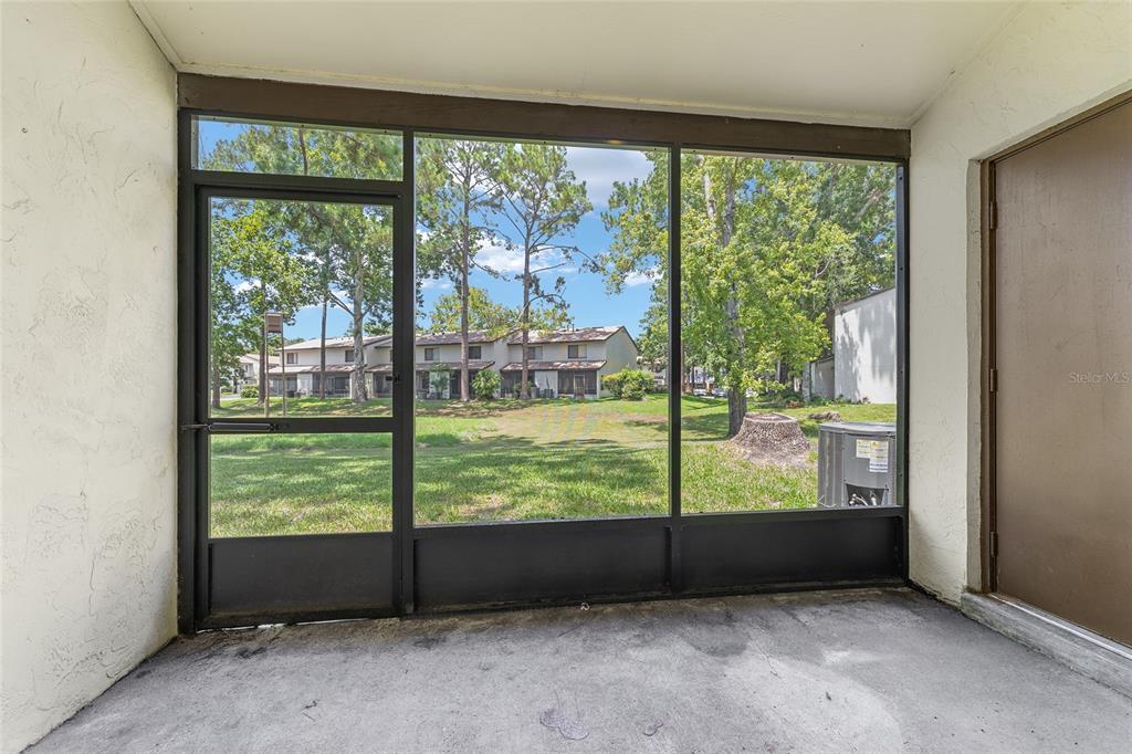 2635 Southwest 35th Place, Unit 604 Gainesville, FL 32608 - Photo 23 of 28 an empty room with wooden floor and balcony