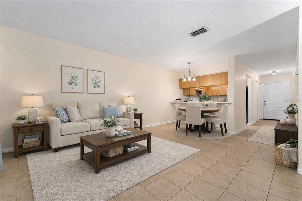 2635 Southwest 35th Place, Unit 604 Gainesville, FL 32608 - Photo 3 of 28 a living room with furniture and view of kitchen