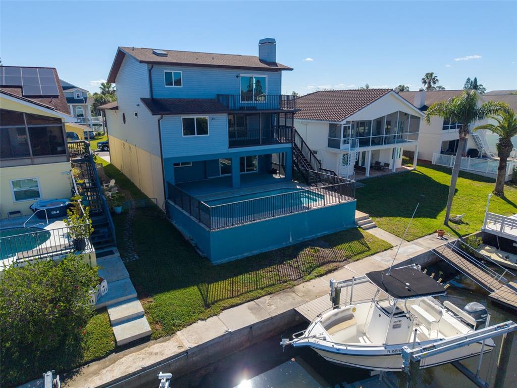 6241 Bayside Drive New Port Richey, FL 34652 - Photo 65 of 78 a view of a house with a patio