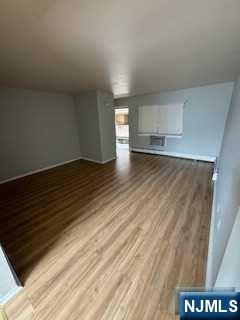 340 Hudson Street, Unit 26 Hackensack, NJ 07601 - Photo 4 of 7 a view of an empty room and window