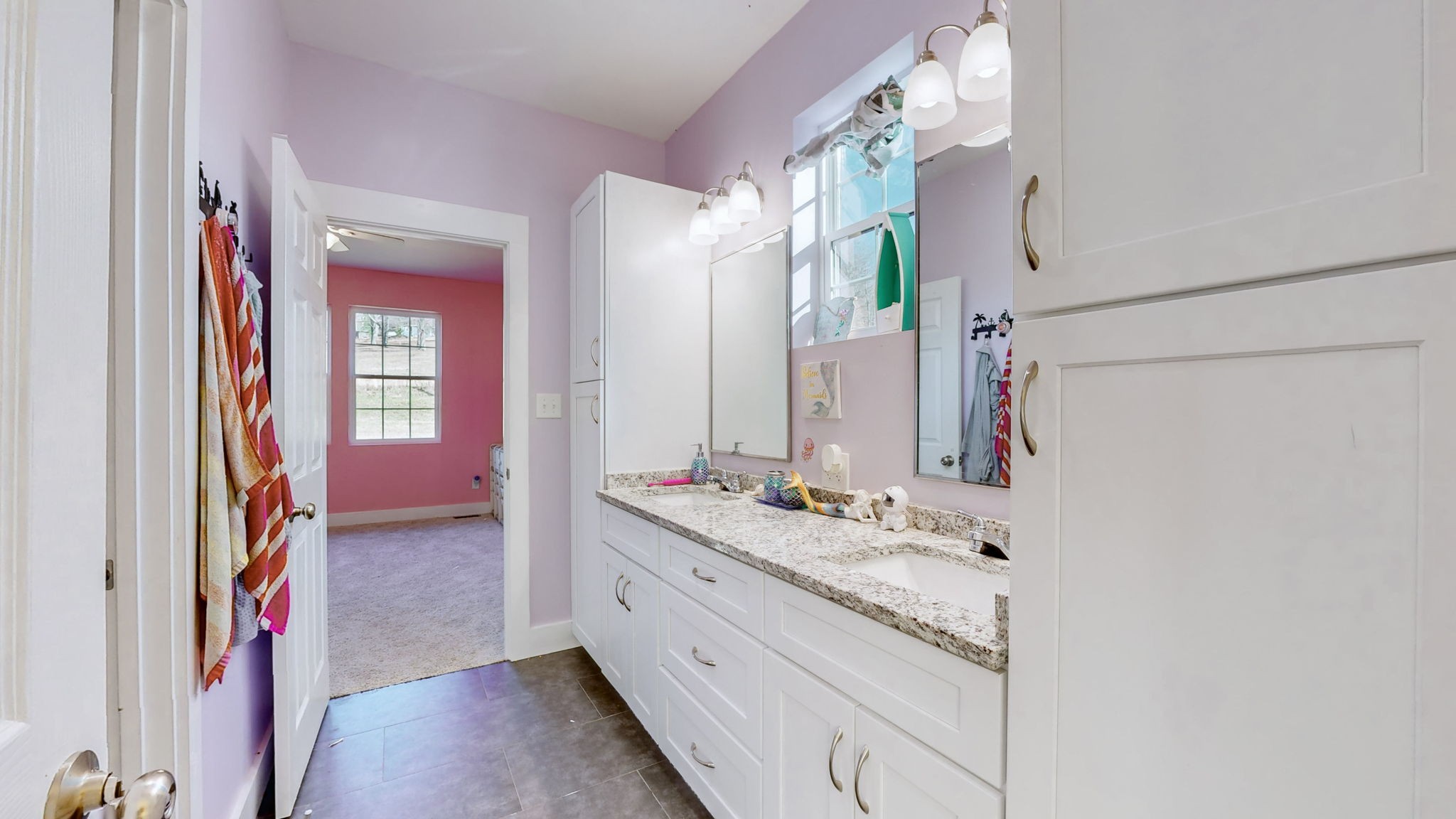 3310 Rocky Branch Road Watertown, TN 37184 - Photo 27 of 52 a bathroom with a sink a vanity and a mirror