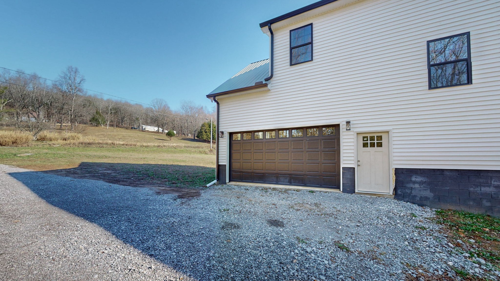 3310 Rocky Branch Road Watertown, TN 37184 - Photo 39 of 52 a view of a house with a yard and garage