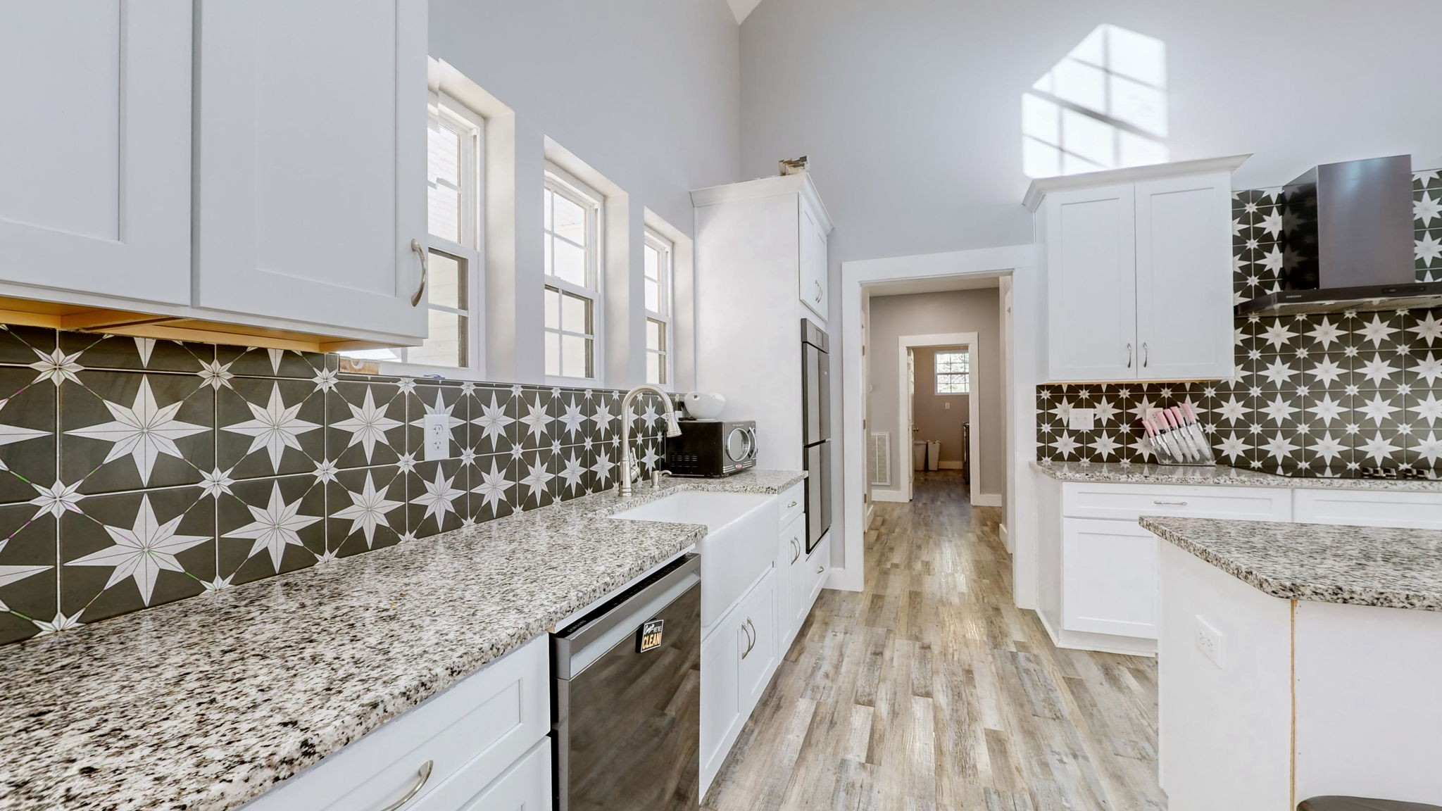 3310 Rocky Branch Road Watertown, TN 37184 - Photo 5 of 52 a kitchen with granite countertop a sink and wooden floor