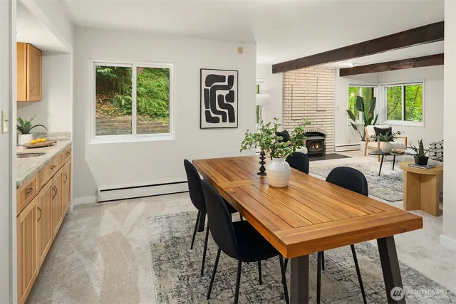 a view of a dining table and chairs in a room