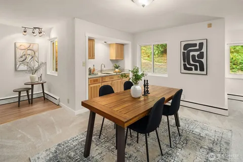 a view of a dining room with furniture window and wooden floor