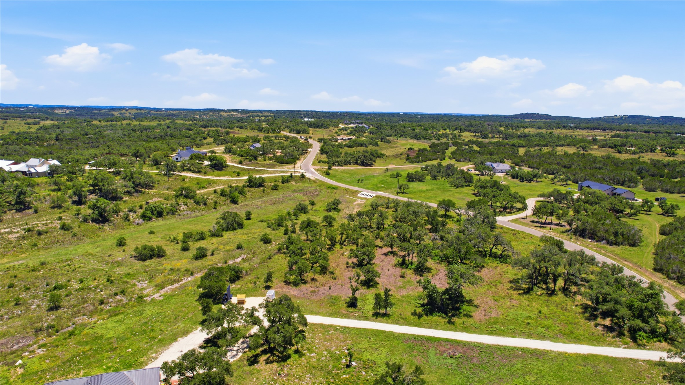 623 Whiskey Trail Blanco, TX 78606 - Photo 19 of 23 Rolling hills and natural greenery offer a picturesque backdrop for custom homes