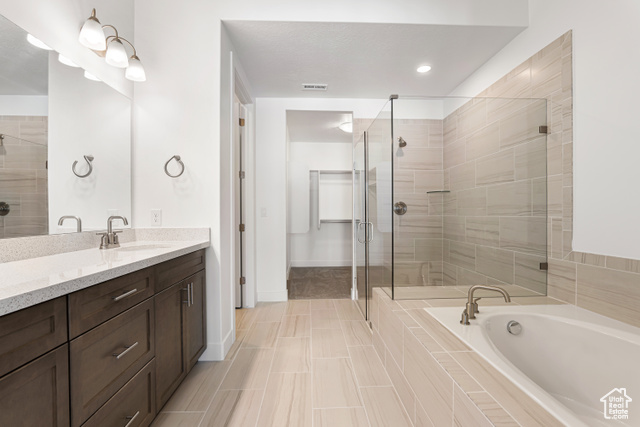 549 North Legend Circle, Unit C/466 Mapleton, UT 84664 - Photo 23 of 39 Bathroom with vanity, a stall shower, a bath, and tile patterned floors