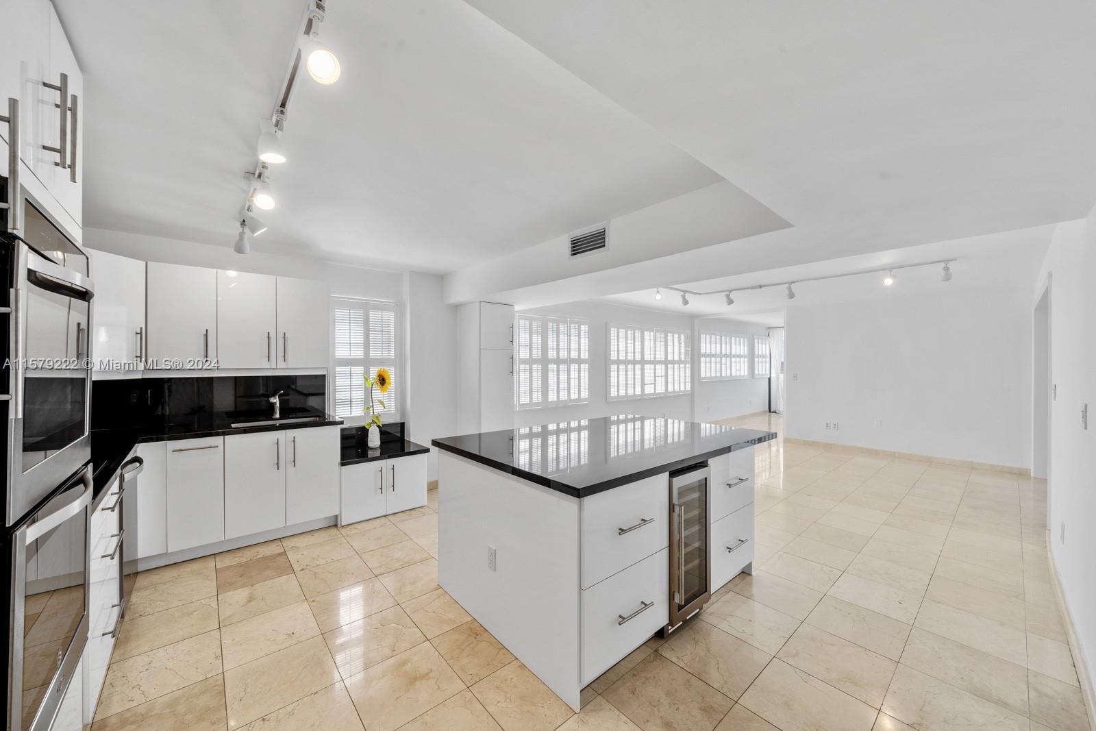 100 Ocean Ln Drive, Unit PH2 Key Biscayne, FL 33149 - Photo 4 of 15 a kitchen with granite countertop a stove and a sink