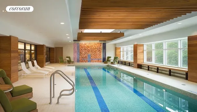 a sign board with buildings in the background