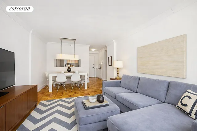 a living room with furniture wooden floor and a flat screen tv