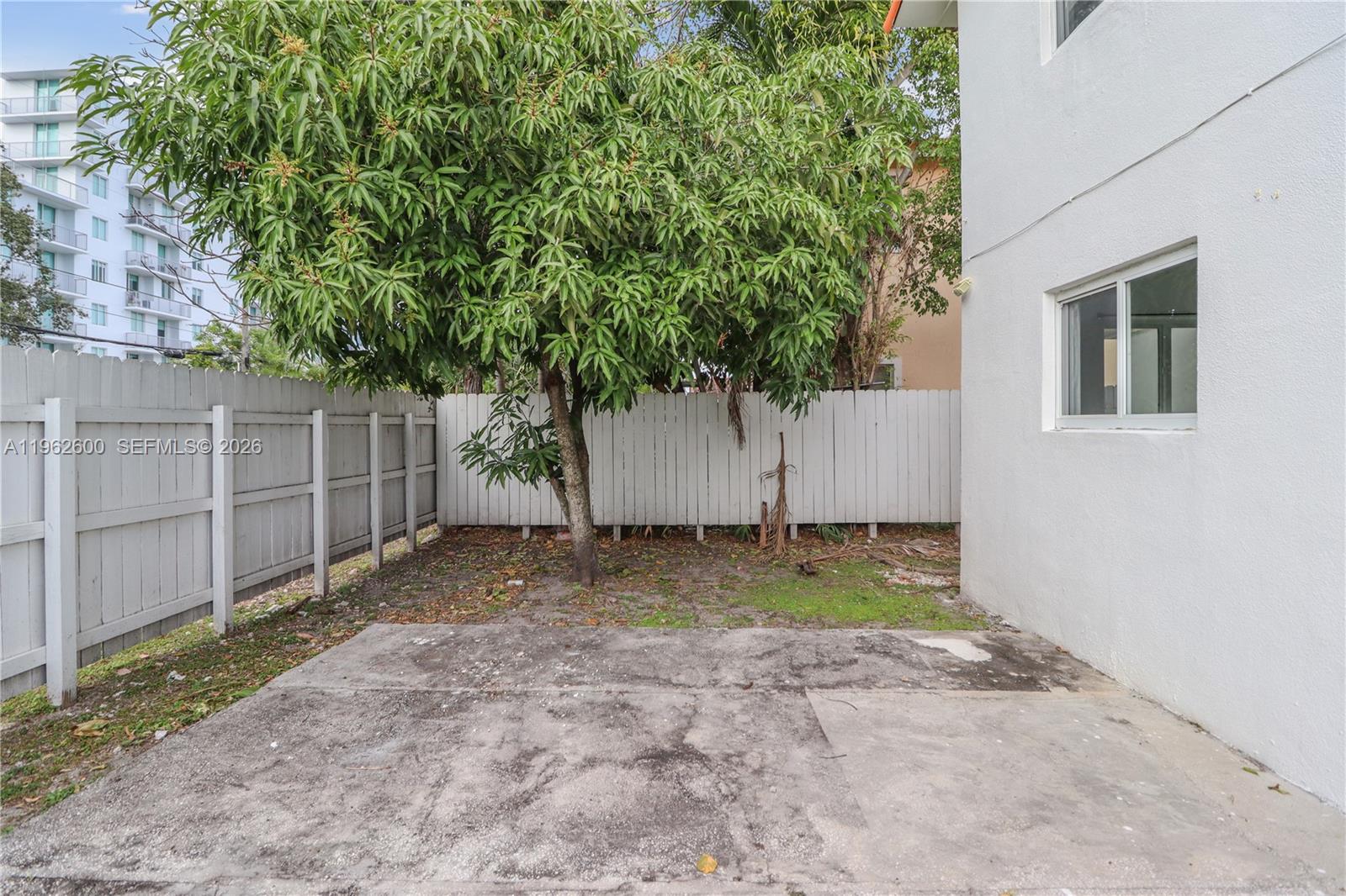3601 Southwest 2nd Street, Unit 3601 Miami, FL 33135 - Photo 17 of 19 a view of a backyard with a tree