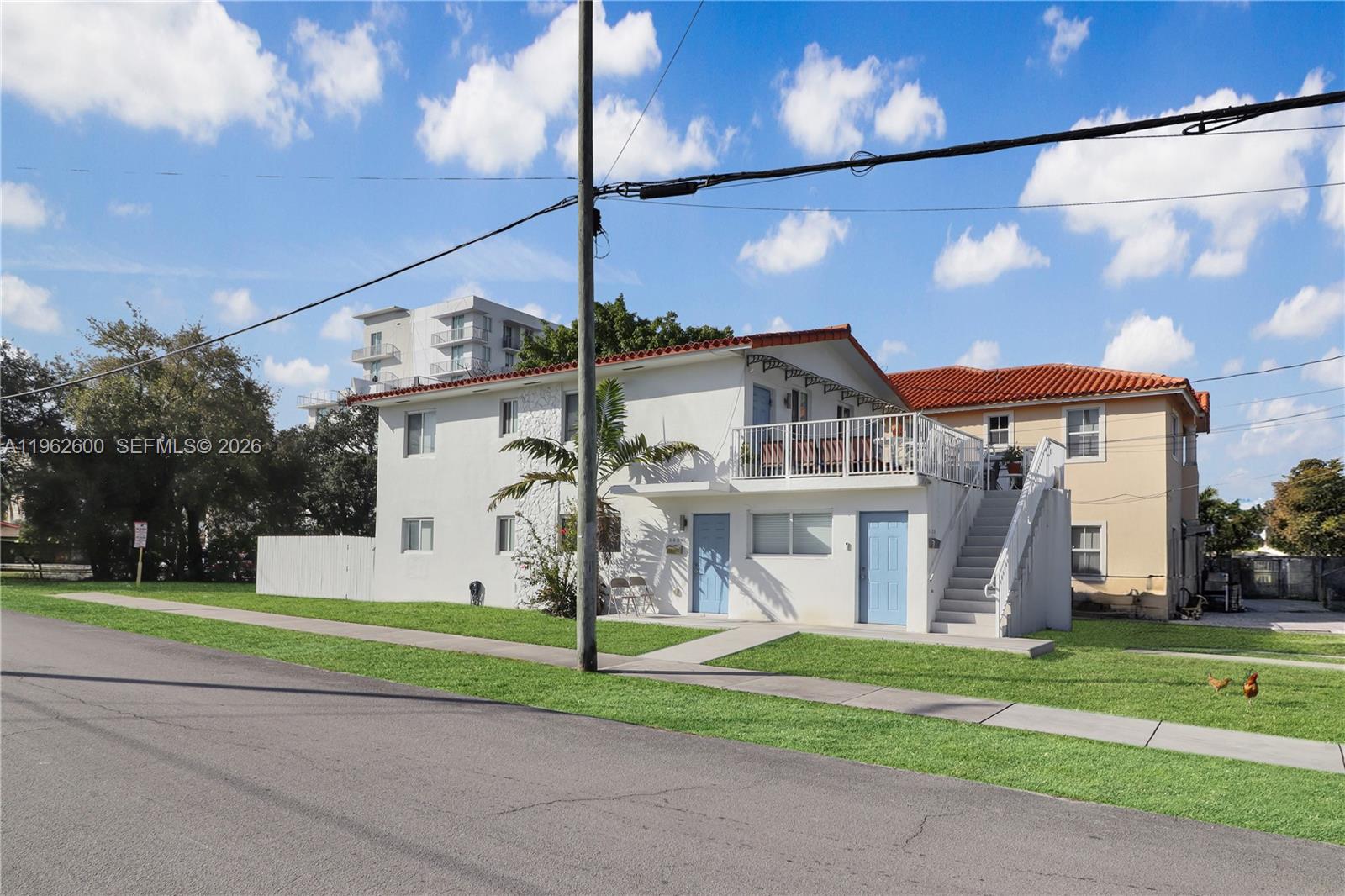 3601 Southwest 2nd Street, Unit 3601 Miami, FL 33135 - Photo 19 of 19 a front view of a house with a yard and garage
