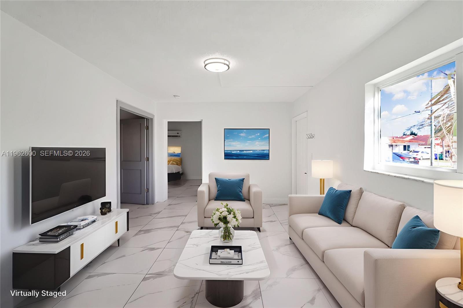 3601 Southwest 2nd Street, Unit 3601 Miami, FL 33135 - Photo 3 of 19 a living room with furniture and a flat screen tv