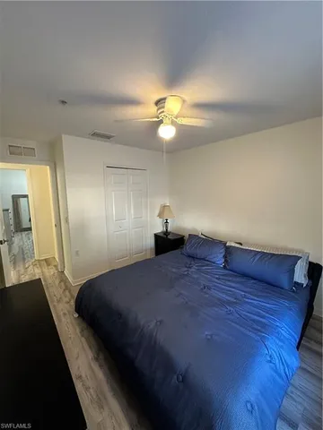 a bathroom with a sink a toilet a mirror and shower