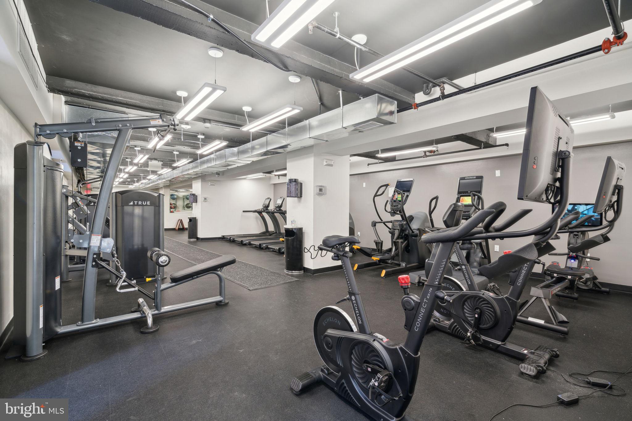 219 South 18th Street, Unit 1605 Philadelphia, PA 19103 - Photo 12 of 15 a view of a room with gym equipment