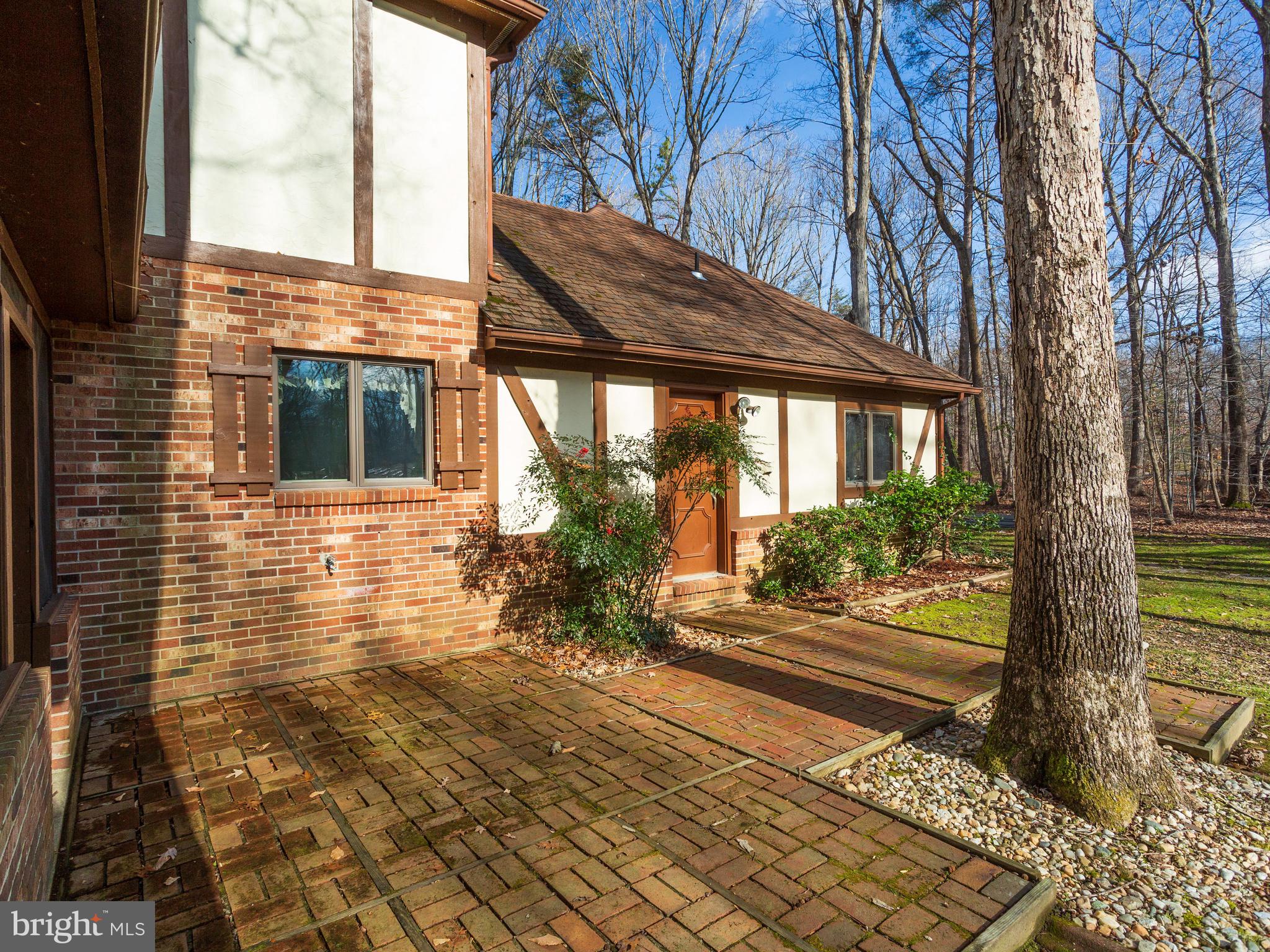 3681 Russell Road Woodbridge, VA 22192 - Photo 45 of 48 Brick Patio looking out at wooded back yard.